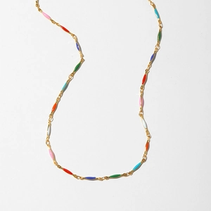 Detail of gold chain necklace featuring colorful evil eye resin charms in vibrant colors