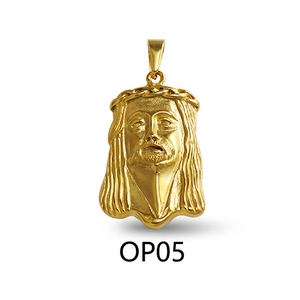 Macro shot of gold-plated Jesus head pendant showing intricate metallic details and carvings