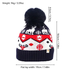 Navy blue winter knitted beanie with Christmas reindeer snowflakes and pompom detail
