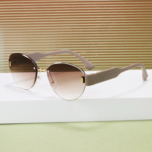 Retro rimless oval sunglasses with gradient brown lenses and embossed temple detail