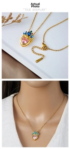 Detailed view of titanium steel necklace with pink crown heart pendant and steel tag