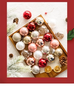 Detailed view of assorted Christmas ball ornaments in a rustic wooden tray decoration