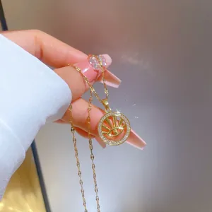 Detailed close-up of gold plated evil eye pendant with micro-pave cubic zirconia crystals