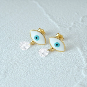 Detailed shot of evil eye stud earrings in gold with enamel and clear crystal drops