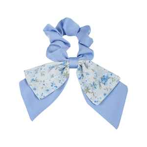 Floral print bow hair scrunchie in blue fabric with long ribbon ties on white background