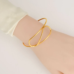 Minimalist 18K gold plated stainless steel open bangle with sleek interlaced lines