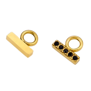 Macro view of gold bar pendant charms with black zircon inlay for DIY jewelry making