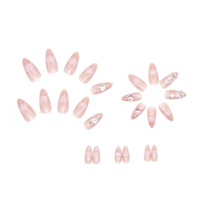 Pink gradient press-on nails with silver heart rhinestones and almond shape tips