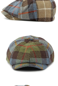Detail view showing British vintage wool plaid newsboy cap with patchwork texture