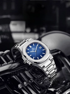 Detail of blue textured dial on luxury stainless steel men's watch with date display