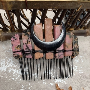 Detail of pink and black amethyst raw stones hand-wired to a black crescent moon hair comb