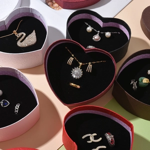 Portable heart-shaped paper jewelry storage boxes in multiple colors for rings and earrings