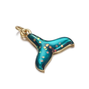 Detail of teal whale tail pendant with gold flakes and glossy enamel for DIY jewelry