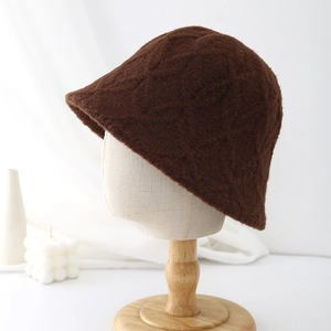 Close-up of dark brown plush bucket hat featuring a textured diamond knit pattern