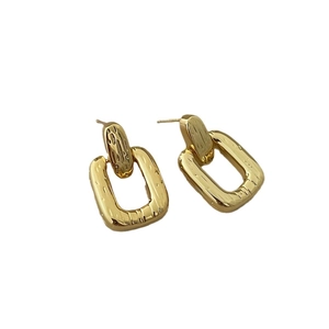 Minimalist gold geometric rectangular earrings with textured hammered metal finish