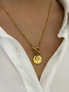 Detail of gold heart pendant with MY KIDS engraving and sparkling rhinestone on OT buckle chain
