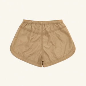 Macro detail of khaki viper-skin textured jogging shorts with soft nylon fabric texture