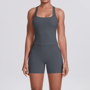 Detail of dark grey racerback sports top and matching high-waisted shorts with side pockets