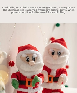 Detail of dancing Santa Claus toys with 'PRESS HERE' button for music and motion