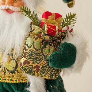 Santa Claus figurine with red jacquard gift bag featuring golden ribbons and ornaments