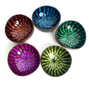 Handcrafted coconut bowls with colorful shell mosaic interiors in five vibrant colors