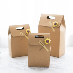 Three brown kraft paper gift bags with sunflower decoration and elegant cutout handles