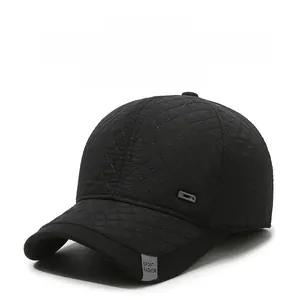 Detail of men's black quilted baseball cap with Sport Fashion tag and metal accent