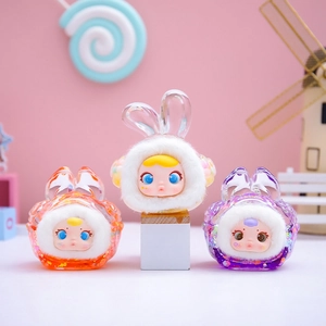 Three cute plush rabbit figurines with transparent resin and glitter in candy theme