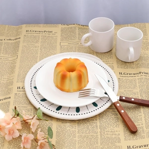 Realistic orange bundt cake squishy model on vintage paper with white ceramic plate