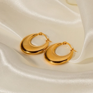 Chic 18K gold plated teardrop stainless steel earrings on elegant silk fabric