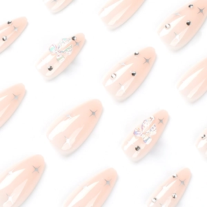 Pink almond press-on nails with silver star patterns, rhinestones, and 3D butterfly bows