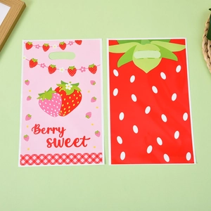 Strawberry printed plastic gift bags in pink and red for kids birthday party favors