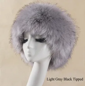 Detail of light grey faux fox fur winter hat with black tips on a display head