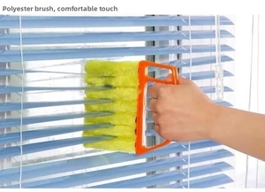 7-row polyester bristle brush cleaning dust from blue window blinds in detail