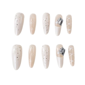 Elegant white French almond press-on nails with bow designs and silver rhinestone accents