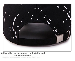 Close-up of adjustable strap and silver metal buckle on black graffiti baseball cap
