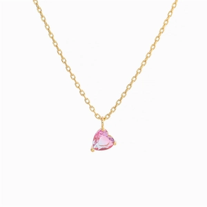 Close-up of pink heart-shaped zircon pendant with 18k gold-plated chain necklace