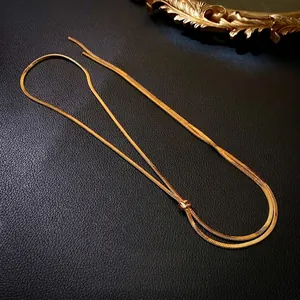 Minimalist gold-plated stainless steel snake chain necklace on premium black leather