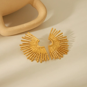 Detailed close-up of 18K gold-plated fan-shaped earrings with radial metal texture