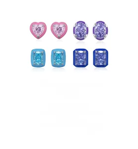 Detail view of s925 silver stud earrings with colorful enamel and faceted gemstones