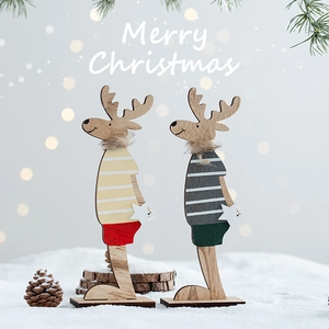 Set of two decorative wooden Christmas reindeer figurines with striped outfits and faux fur