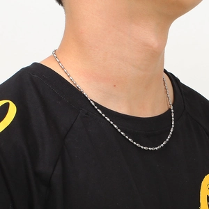 Silver stainless steel bead chain necklace for men and women worn on a black t-shirt