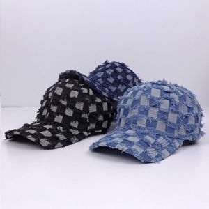 Denim checkerboard baseball cap in black and blue with distressed frayed edges