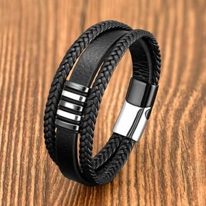 Close-up of multilayer braided black leather bracelet with silver stainless steel buckle