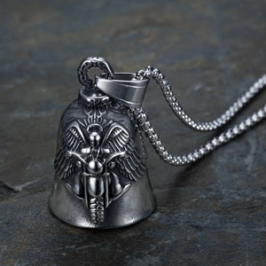 Macro shot of silver stainless steel bell pendant with embossed motorcycle angel design