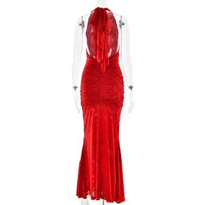 Detail of red floral lace fabric on backless slim-fit maxi dress with halter neckline