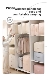 Detail of multi-color satin storage bags with widened handles and dual zippers in closet