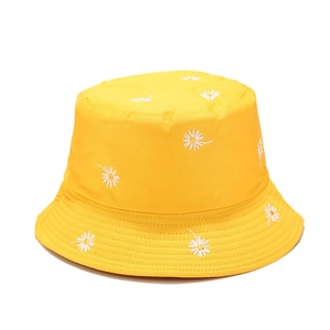Bright yellow reversible bucket hat with white daisy embroidery and reinforced brim