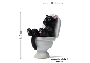 Miniature black cat figurine on white toilet with dimensions 3.5cm height and 8g weight
