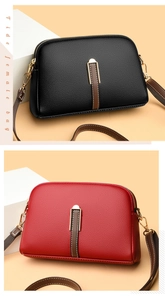 Detail view of shell cross-body bags in black and red lychee texture with gold hardware